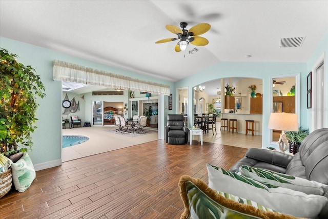 living room with vaulted ceiling and ceiling fan