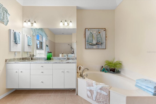 bathroom featuring vanity, a bath, and tile patterned floors