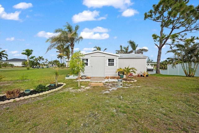 back of house with a lawn