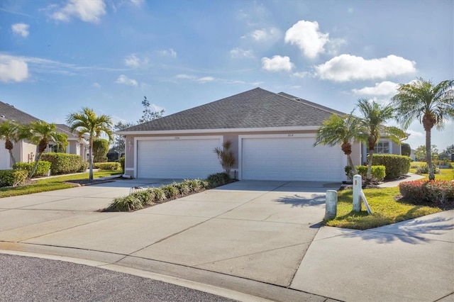 ranch-style house featuring a garage