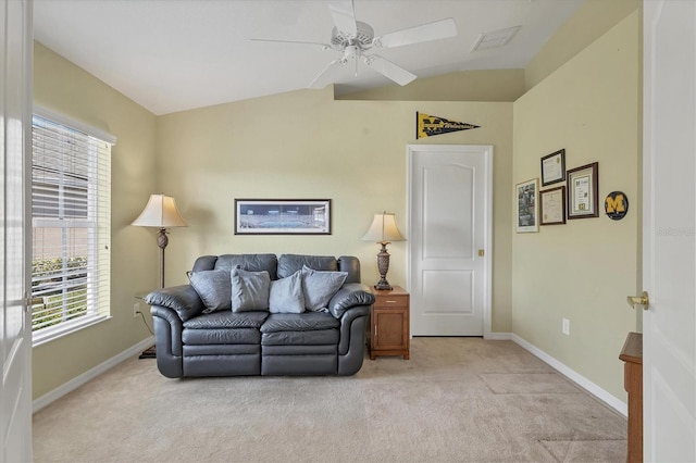 living room featuring vaulted ceiling, light colored carpet, and ceiling fan