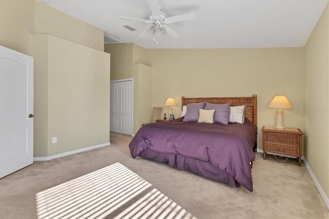 carpeted bedroom featuring ceiling fan and a closet