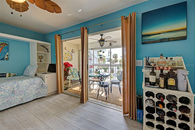 bedroom with ceiling fan, light hardwood / wood-style flooring, and access to outside