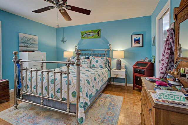 bedroom featuring parquet flooring and ceiling fan