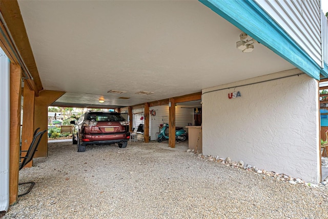 garage featuring a carport