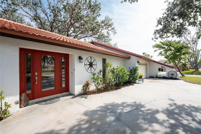 doorway to property featuring a garage