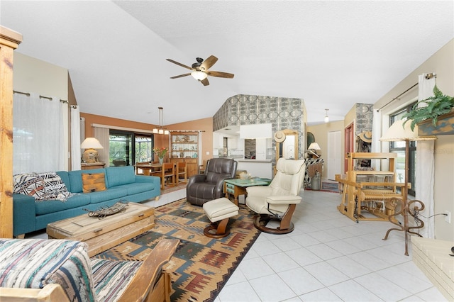 tiled living room with ceiling fan and lofted ceiling