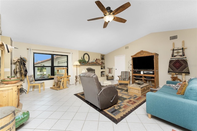 living room with lofted ceiling, light tile patterned floors, ceiling fan, and a brick fireplace