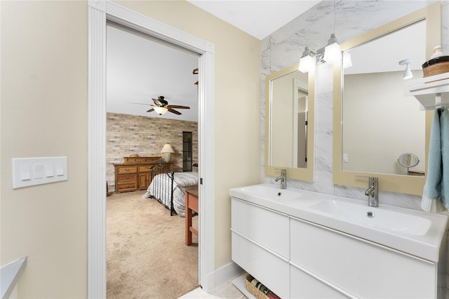 bathroom featuring vanity, ceiling fan, and wood walls