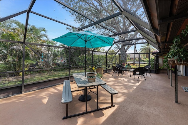 view of patio featuring a lanai