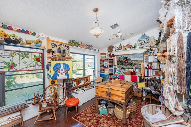 office with lofted ceiling, ceiling fan, hardwood / wood-style flooring, and a textured ceiling