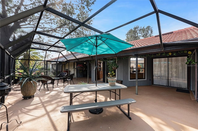 view of patio / terrace featuring a lanai