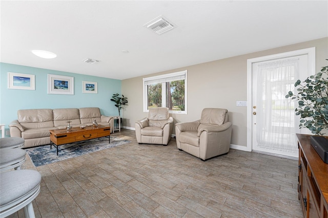 living room with light hardwood / wood-style floors