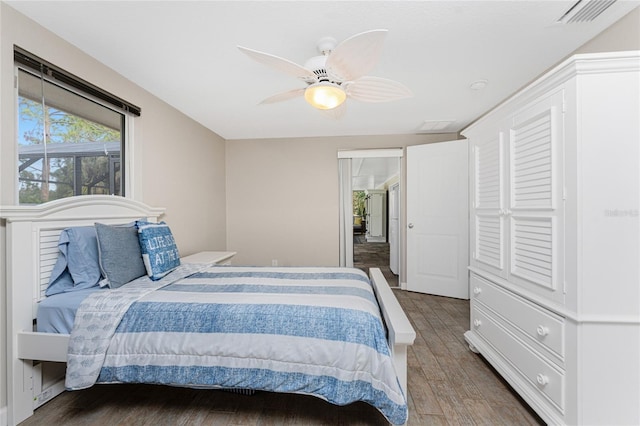 bedroom with wood-type flooring and ceiling fan