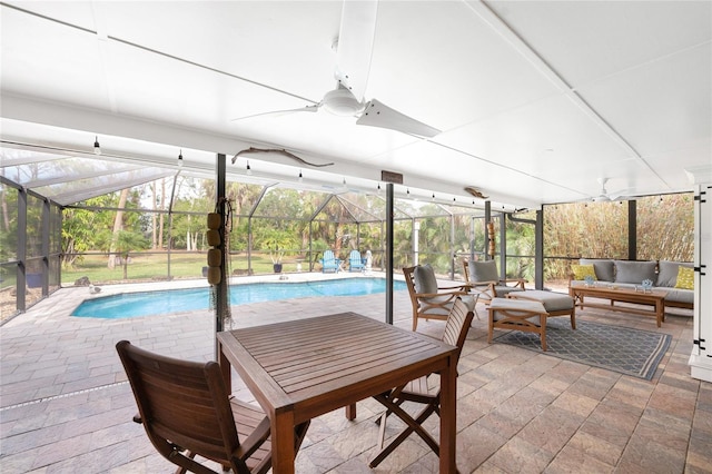 exterior space featuring a lanai, an outdoor hangout area, ceiling fan, and a patio area