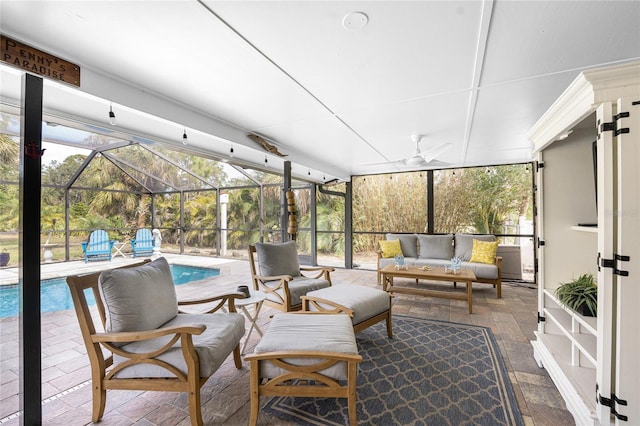 sunroom featuring ceiling fan and a healthy amount of sunlight