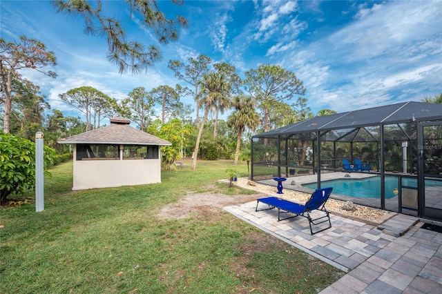 view of yard featuring a gazebo, a patio, and glass enclosure