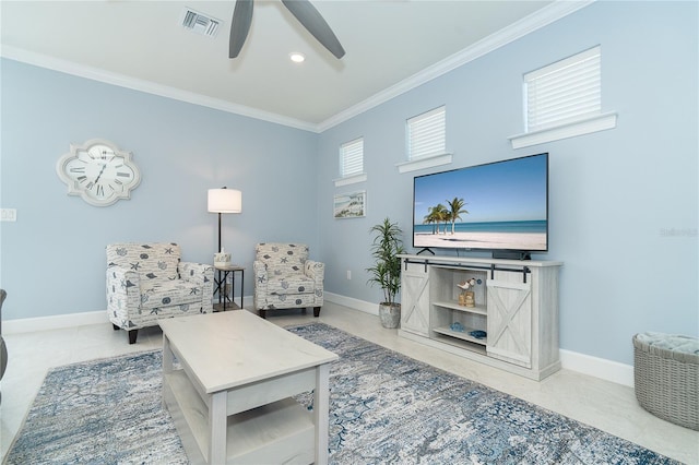 sitting room featuring ceiling fan, ornamental molding, and light tile patterned floors