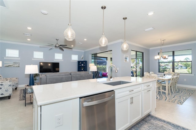 kitchen featuring decorative light fixtures, dishwasher, an island with sink, sink, and white cabinets