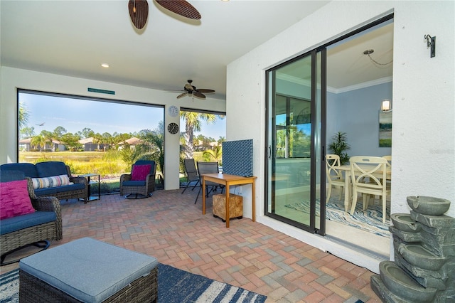 view of patio with ceiling fan and an outdoor hangout area