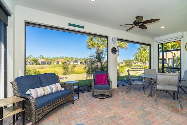 sunroom / solarium with ceiling fan