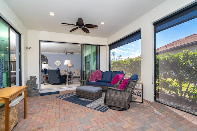 sunroom / solarium with ceiling fan