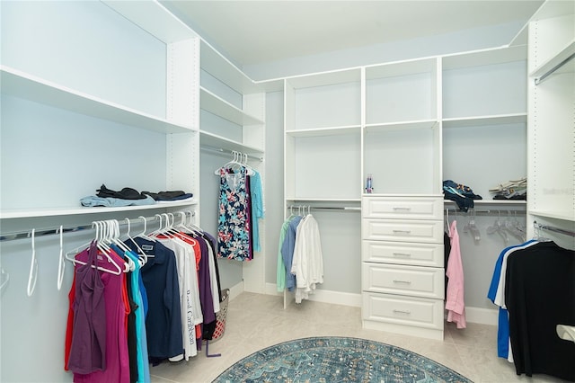 walk in closet featuring light tile patterned floors