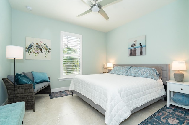 bedroom with ceiling fan and light tile patterned floors