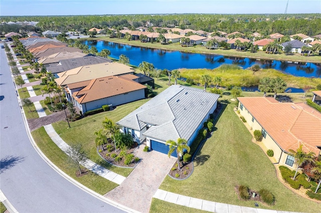 birds eye view of property with a water view