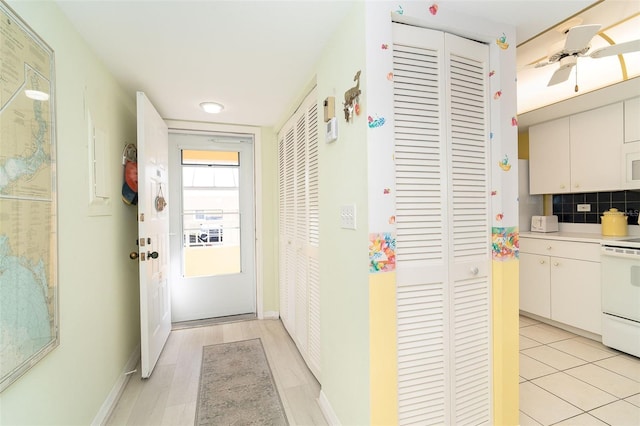 hall with light hardwood / wood-style floors