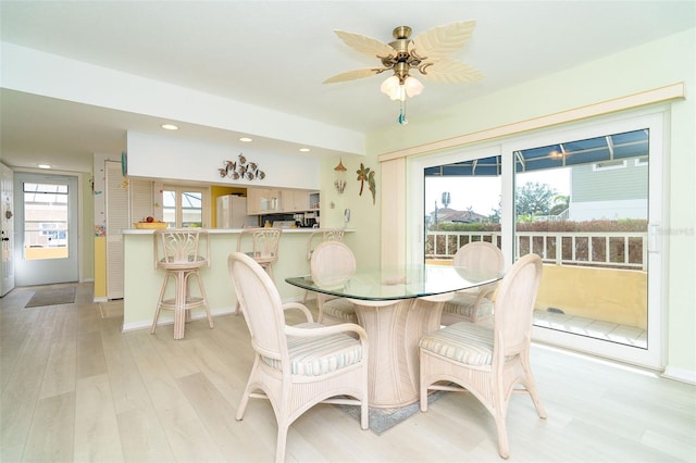 dining area featuring ceiling fan and light hardwood / wood-style flooring