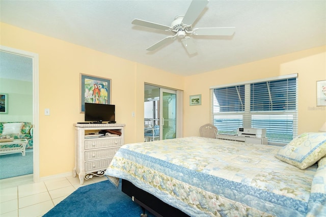 tiled bedroom with access to exterior and ceiling fan