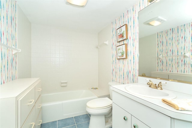 full bathroom featuring vanity, tiled shower / bath combo, tile patterned floors, and toilet