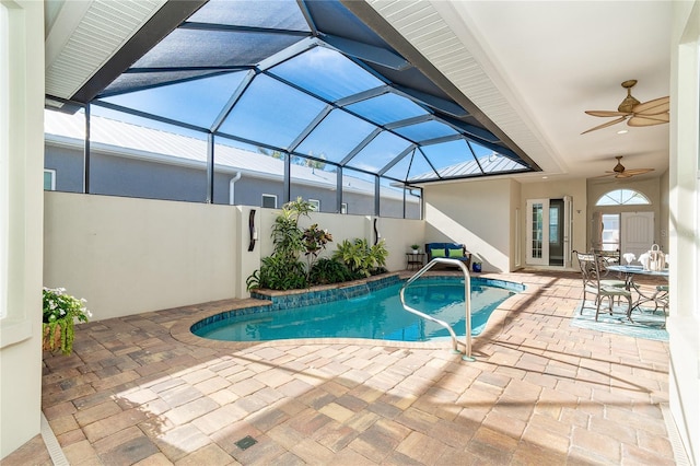 view of swimming pool with a lanai, a patio, and ceiling fan