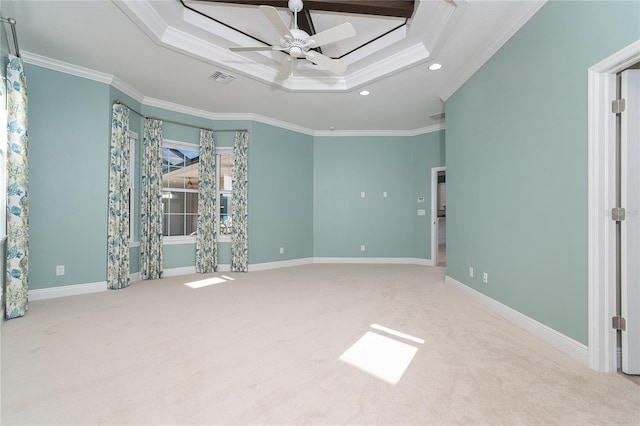 unfurnished bedroom with crown molding, carpet flooring, ceiling fan, and a tray ceiling