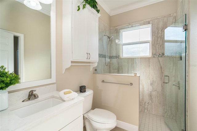 bathroom with vanity, ornamental molding, toilet, and walk in shower