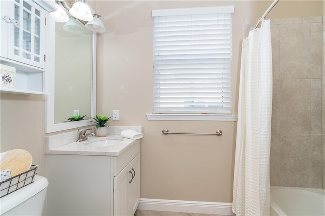 full bathroom featuring vanity, toilet, and shower / tub combo