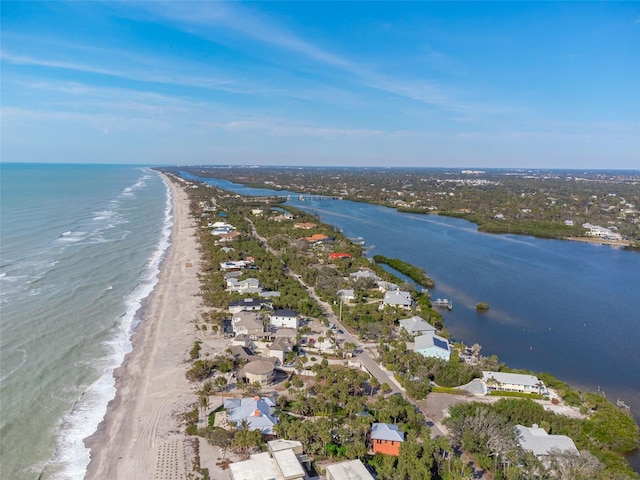 bird's eye view featuring a water view and a view of the beach