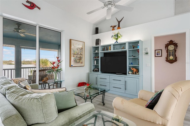 living room with vaulted ceiling, ceiling fan, and light hardwood / wood-style floors