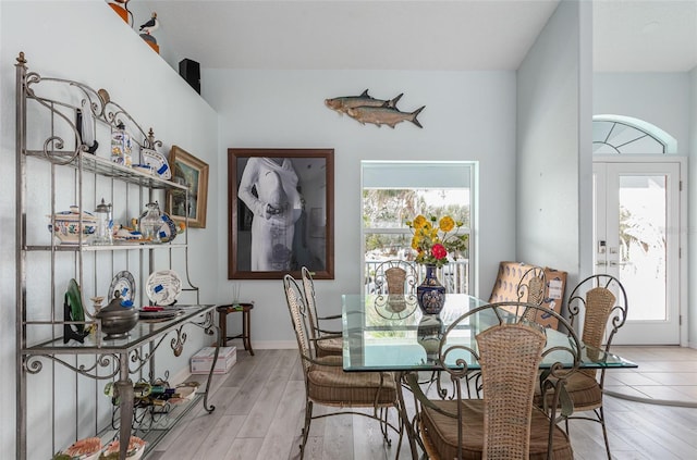 dining space with light hardwood / wood-style flooring