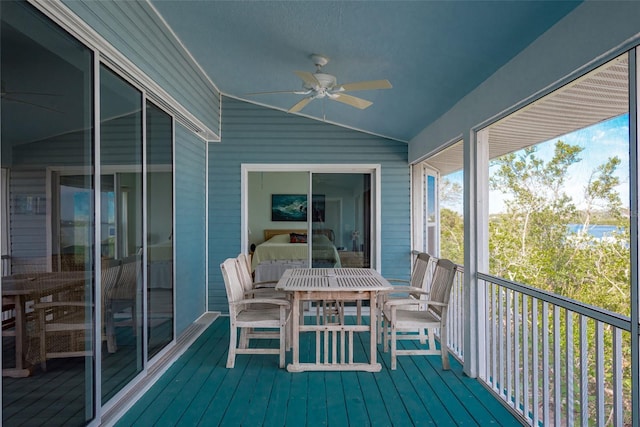 sunroom / solarium with ceiling fan and lofted ceiling