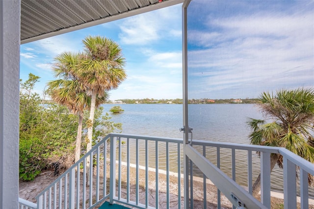 wooden deck featuring a water view