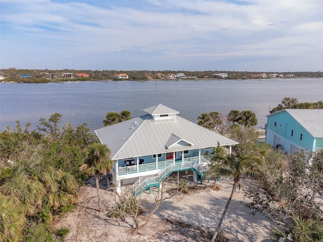 drone / aerial view with a water view