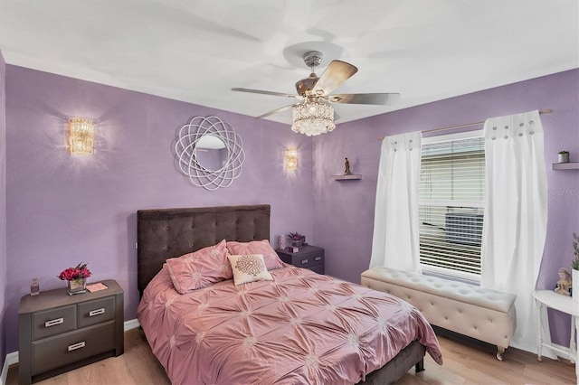 bedroom featuring ceiling fan and light hardwood / wood-style floors