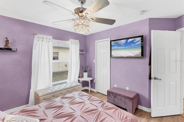 bedroom featuring ceiling fan and light hardwood / wood-style floors