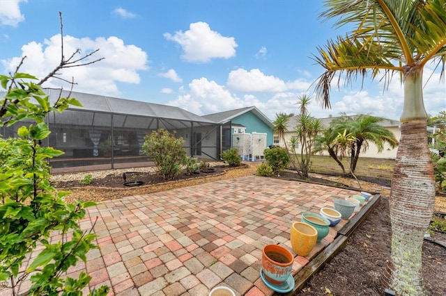 view of patio with a lanai