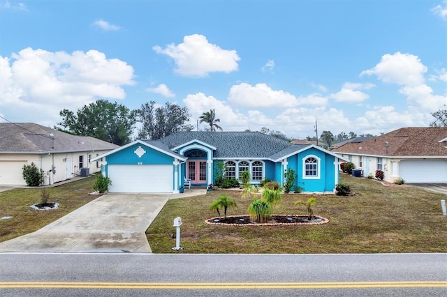 ranch-style house featuring a front yard, french doors, and central air condition unit