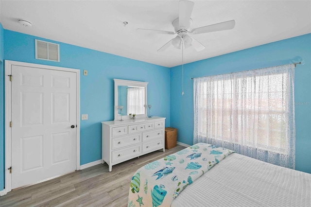 bedroom featuring light wood-type flooring and ceiling fan