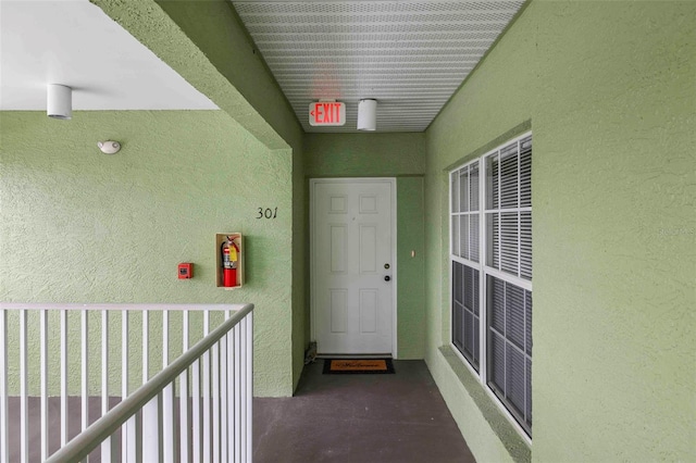 property entrance with a balcony