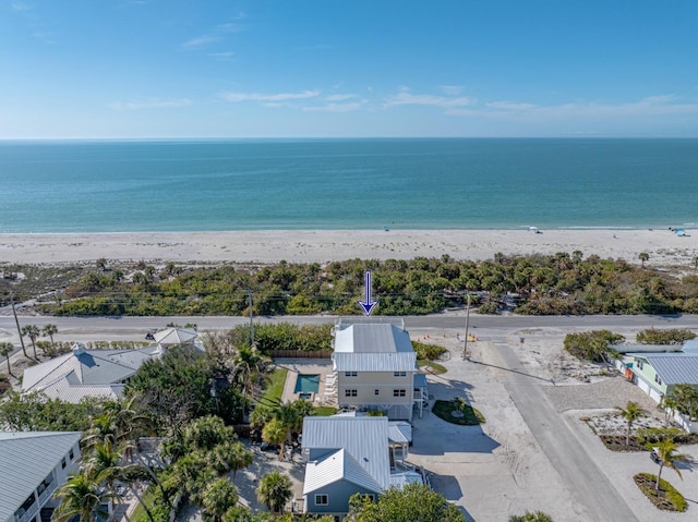 aerial view featuring a water view and a beach view